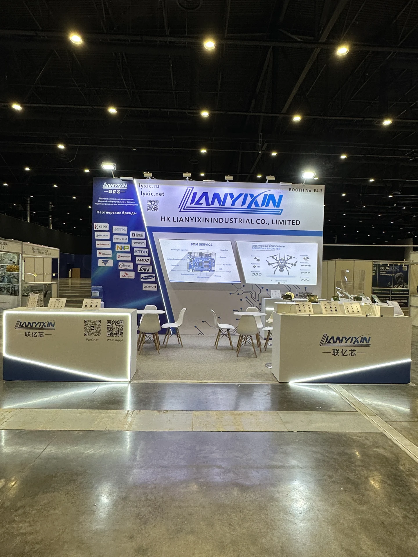 Front view: the blue-and-white booth and product counters.